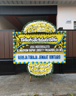 Papan Bunga Duka di Siokona